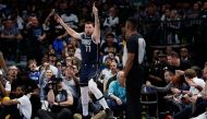 DALLAS, TEXAS - MARCH 22: Luka Doncic #77 of the Dallas Mavericks reacts after a call in the second half against the Golden State Warriors at American Airlines Center on March 22, 2023 in Dallas, Texas.