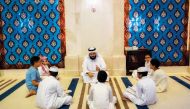 Children take part in a contest to memorise parts of the Holy Quran, as part of Ramadan activities, at the Katara Mosque. 