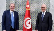 Tunisian Foreign Minister Nabil Ammar (right) welcomes European Commissioner for Economic Affairs Paolo Gentiloni in Tunis on March 27, 2023, to discuss reforms and possible financial assistance. (Photo by FETHI BELAID / AFP)
 