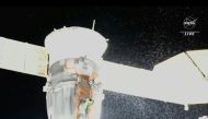 In this file photo taken on December 15, 2022 Video grab from a NASA feed obtained December 15, 2022 shows liquid spraying from the aft end of the Soyuz MS-22 spacecraft. Photo by HANDOUT / NASA / AFP