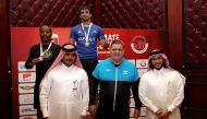QWF President Sheikh Fahad bin Khalid Al Thani with martial arts expert Rigan Machado at a medals presentation ceremony. 