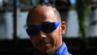 Mercedes' British driver Lewis Hamilton arrives ahead of the first practice session of the 2023 Formula One Australian Grand Prix at the Albert Park Circuit in Melbourne on March 31, 2023. (Photo by WILLIAM WEST / AFP)