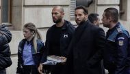 File photo: Andrew Tate and his brother Tristan are escorted by police officers outside the headquarters of the Bucharest Court of Appeal, in Bucharest, Romania, on January 10, 2023. Inquam Photos/Octav Ganea via REUTERS

