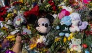 Flowers, balloons, and other items are left at a make shift memorial at the entrance of The Covenant School on April 1, 2023 in Nashville, Tennessee. Photo by Seth Herald / GETTY IMAGES NORTH AMERICA / Getty Images via AFP