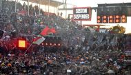 Spectators wait for the race to resume during the 2023 Formula One Australian Grand Prix at the Albert Park Circuit in Melbourne on April 2, 2023. Photo by Paul CROCK / AFP