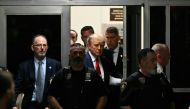 Former US President Donald Trump makes his way inside the Manhattan Criminal Courthouse in New York on April 4, 2023. (Photo by Ed Jones / AFP)