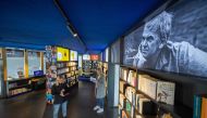 Visitors to the Milan Kundera library in Brno, Czech Republic read books by the Czech novelist on April 6, 2023. Photo by Radek Mica / AFP