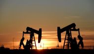 Pump jacks operate at sunset in an oil field in Midland, Texas US in this file photo. 