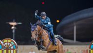 Qatari rider Faleh Suwead Al Ajami astride Crispo celebrates after winning the final round. INSET: Al Ajami receives trophy from QEFMP President Bader Al Darwish.   