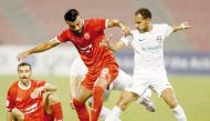 Action during the match between Al Arabi and Al Ahli. 