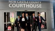 Justin Nelson (2R), joined by fellow members of the Dominion Voting Systems legal team, depart the Leonard Williams Justice Center in Wilmington, Delaware, on April 18, 2023. - Vote machine maker Dominion and Fox News settled a defamation case over falsehoods about the 2020 presidential election aired on the conservative TV network, a US judge announced Tuesday. (Photo by ANDREW CABALLERO-REYNOLDS / AFP)