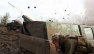 Artillerymen of the Ukrainian 80th separate airborne assault brigade fire from a BM-21 Grad multiple rocket launcher towards Russian positions on the front line near Bakhmut in the Donetsk region, on April 18, 2023, amid the Russian invasion of Ukraine. (Photo by Anatolii Stepanov / AFP)