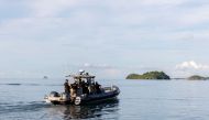 French gendarmes of the nautical brigade operate on the Mukombe boat, preparing for an operation against illegal migration in French territorial seas on the island of Mayotte, on April 24, 2023. (Photo by Morgan Fache / AFP)
