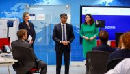 Britain's Prime Minister Rishi Sunak (centre) meets with teams coordinating the evacuation of British nationals from Sudan at the FCDO Crisis Centre, in London, April 25, 2023. (Photo by HANNAH MCKAY / POOL / AFP)