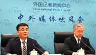 Yu Jun (left), deputy director of the Eurasia Department of China痴 Foreign Ministry, speaks at a briefing about the phone call between Chinese President Xi Jinping and Ukraine's President Volodymyr Zelensky, as Foreign Ministry spokesman Wang Wenbin looks on at the Foreign Ministry in Beijing on April 26, 2023. (Photo by Greg Baker / AFP)