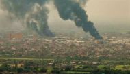 This image grab taken from AFPTV video footage on April 28, 2023, shows an aerial view of black smoke rising over Khartoum. (Photo by AFPTV / AFP)

