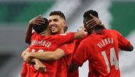 Al Duhail players celebrate their victory against Umm Salal on Saturday.