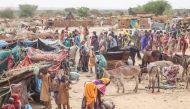 Sudanese refugees from the Tandelti area who crossed into Chad, in Koufroun, near Echbara, are seen on April 30, 2023. (Photo by Gueipeur Denis Sassou / AFP)