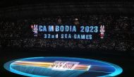 The national flag of Cambodia is brought into the Morodok Techo National Stadium at the start of the opening ceremony of the 32nd Southeast Asian Games (SEA Games) in Phnom Penh on May 5, 2023. (Photo by MOHD RASFAN / AFP)