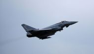 A Typhoon jet takes off from the RAF's Coningsby base in Lincolnshire, the UK, in 2018 [File: Phil Noble/pool/AFP]