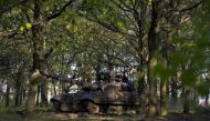 Ukrainian servicemen of the Adam tactical group ride a T-64 tank from a front line near the town of Bakhmut, Donetsk region, on May 7, 2023, amid the Russian invasion of Ukraine. (Photo by Sergey Shestak / AFP)