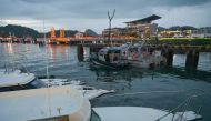 Indonesian Navy patrol and ambulance boats (C) are seen in front of the Meruorah Hotel, the main venue for the Association of Southeast Asian Nations (ASEAN) Summit, in Labuan Bajo on May 8, 2023, on the eve of the event. (Photo by Bay ISMOYO / AFP)