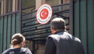 Turkish citizens are seen in front of the Turkish consulate in Vienna, Austria on the last day of the presidential elections, on May 9, 2023. (Photo by Alex Halada / AFP)