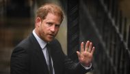 Britain's Prince Harry, Duke of Sussex waves as he arrives at the Royal Courts of Justice, Britain's High Court, in central London on March 28, 2023. (Photo by Daniel Leal / AFP)