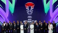 QFA President Sheikh Hamad bin Khalifa bin Ahmed Al Thani, FIFA President Gianni Infantino and AFC President Shaikh Salman bin Ebrahim Al Khalifa along with coaches pose for a picture with the trophy after the Draw. PICS: AFP