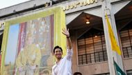 Move Forward Party leader and prime ministerial candidate Pita Limjaroenrat (C) waves to his supporters during a victory parade in Bangkok on May 15, 2023. (Photo by MANAN VATSYAYANA / AFP)