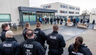 In this file photo taken on January 10, 2023, police officers secure the building of the Higher Regional Court in Dresden, eastern Germany, prior to a hearing in the trial over a jewellery heist on the Green Vault (Gruenes Gewoelbe) museum in Dresden's Royal Palace in November 2019. (Photo by Jens Schlueter / AFP)