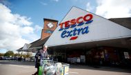 File Photo: A woman walks past a Tesco supermarket in Hatfield, Britain October 6, 2020. (Reuters /Peter Cziborra)