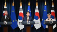 South Korea's President Yoon Suk Yeol (C) speaks as Charles Michel (L), President of the European Council, and Ursula von der Leyen (R), President of the European Commission, look on during a joint press briefing after their meeting at the Presidential Office in Seoul on May 22, 2023. Photo by JUNG YEON-JE / POOL / AFP