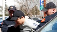 File photo: South Korean cryptocurrency entrepreneur co-founder of Terraform Labs (Terra Luna), Do Kwon (C) is taken to court after being arrested at the airport on March 24, 2023 in Podgorica.

