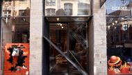 This photograph taken on May 25, 2023 in Lille shows the outside of the Hermes luxury store on the prestigious rue Grande-Chaussee where robbers used a car to ram the security gate and gain entry into the store. Photo by Sameer Al-Doumy / AFP
