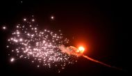This photograph taken on May 28, 2023, in Kyiv, shows the explosion of a drone after it was shot down during a massive Russian drones strike mainly targetting the Ukrainian capital. (Photo by Sergei Supinsky / AFP)