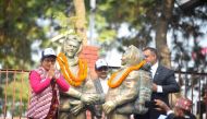 Nepali government officials place garlands on the statues of New Zealand's Sir Edmund Hillary and Nepal's Tenzing Norgay Sherpa to mark the 16th International Everest Day or a day to mark the 70th anniversary of the first ascent of Mount Everest in Kathmandu on May 29, 2023. (Photo by Nisha Bhandari / AFP)