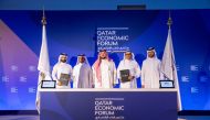Officials at the signing of the agreement at Qatar Economic Forum. 