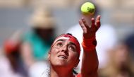Tunisia's Ons Jabeur serves to Italy's Lucia Bronzetti during their women's singles match on day three of the Roland-Garros Open tennis tournament at the Court Philippe-Chatrier in Paris on May 30, 2023. (Photo by Anne-Christine POUJOULAT / AFP)