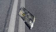 This handout picture posted on June 1, 2023 on the official Telegram account of Vyacheslav Gladkov, governor of the Belgorod region, shows what is presented as a part of an unmanned aerial vehicle (drone) on a street in the region capital of Belgorod. Photo by Handout / TELEGRAM / VVGLADKOV / AFP