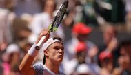 Denmark's Holger Rune celebrates after winning against Argentina's Genaro Alberto Olivieri at the end of their men's singles match on day seven of the Roland-Garros Open tennis tournament at the Court Philippe-Chatrier in Paris on June 3, 2023. (Photo by Thomas SAMSON / AFP)
 