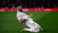 Real Madrid's French forward Karim Benzema celebrates scoring a goal that was later annulled during the Spanish League football match between Real Betis and Real Madrid CF at the Benito Villamarin stadium in Seville on March 5, 2023. (Photo by Cristina Quicler / AFP)