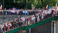 People attend an anti-government demonstration organized by the opposition in Warsaw on June 4, 2023. (Photo by Wojtek Radwanski / AFP)
