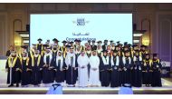 Minister of Transport H E Jassim bin Saif Al Sulaiti with the graduating students.