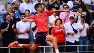 Serbia's Novak Djokovic celebrates his victory over Norway's Casper Ruud during their men's singles final match on day fifteen of the Roland-Garros Open tennis tournament at the Court Philippe-Chatrier in Paris on June 11, 2023. (Photo by Emmanuel Dunand / AFP)