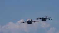 Two Airbus A400M military aircrafts of the German Armed Forces Bundeswehr approach during the Air Defender Exercise 2023 in the military air base in Wunstorf, northern Germany, on June 12, 2023. (Photo by Ronny Hartmann / AFP)
