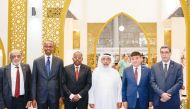 Minister of Awqaf and Islamic Affairs H E Ghanem bin Shaheen bin Ghanem Al Ghanem (third right) during his visit to the Ministry’s pavilion at the 32nd Doha International Book Fair yesterday.
