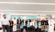 Officials and students from Nord Anglia International School Al Khor, Ras Laffan Industrial City Community Outreach Programme and local tech company Gamyra.
