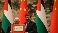 China's President Xi Jinping (right) and Palestinian President Mahmud Abbas attend a signing ceremony at the Great Hall of the People in Beijing on June 14, 2023. (Photo by Jade Gao / POOL / AFP)