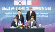 Minister of Commerce and Industry H E Sheikh Mohammed bin Hamad bin Qassim Al Thani and Minister of Trade, Industry and Energy of the Republic of Korea H E Lee Chang-Yang along with other officials during the signing ceremony.